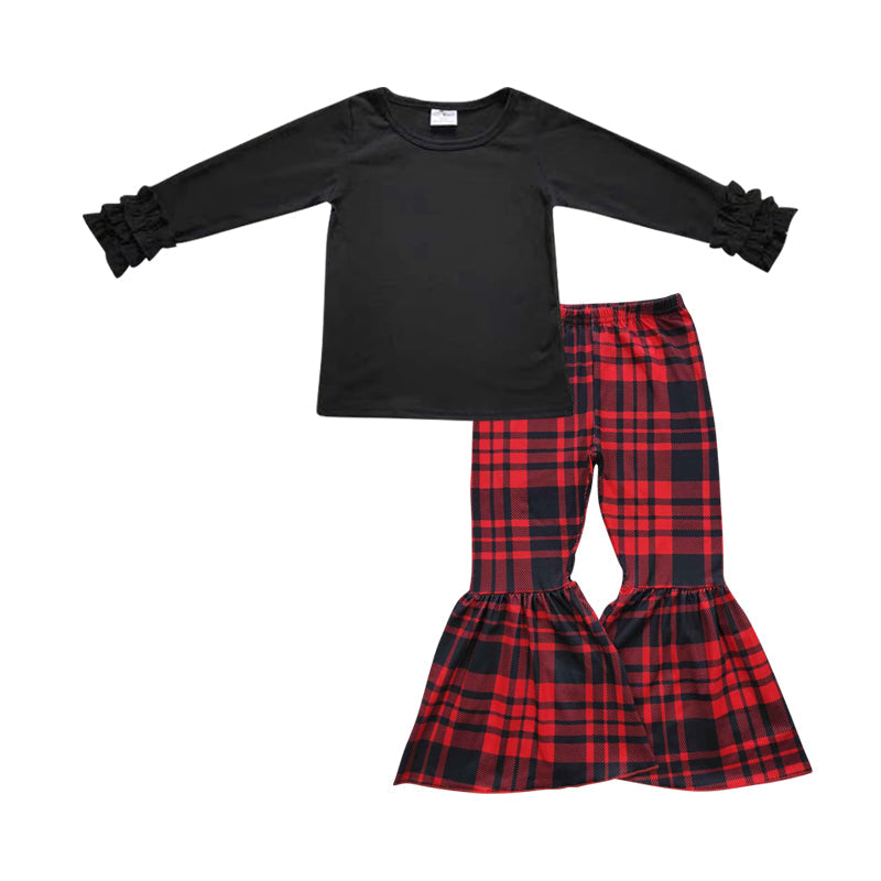 Mädchen Weihnachtsoutfits: Schwarzes Rüschenoberteil mit Karomuster-Hose
