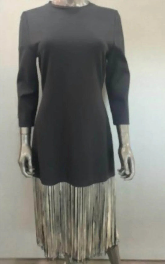 Black dress with black and white fringes at the bottom