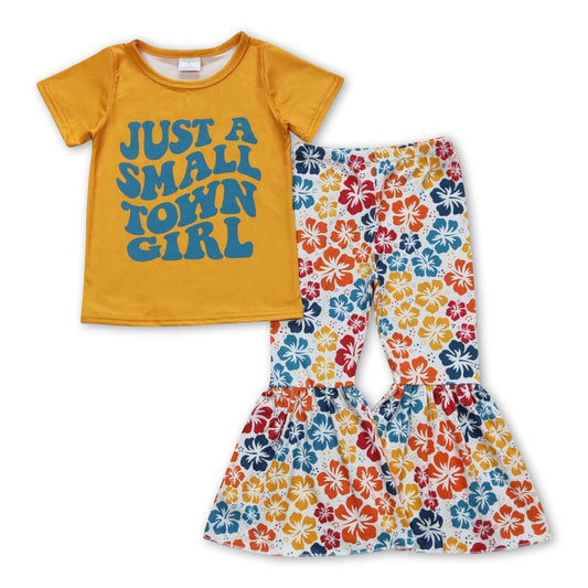 Kleines Mädchen aus der Kleinstadt, Blumenmusterhose, Kinderkleidung