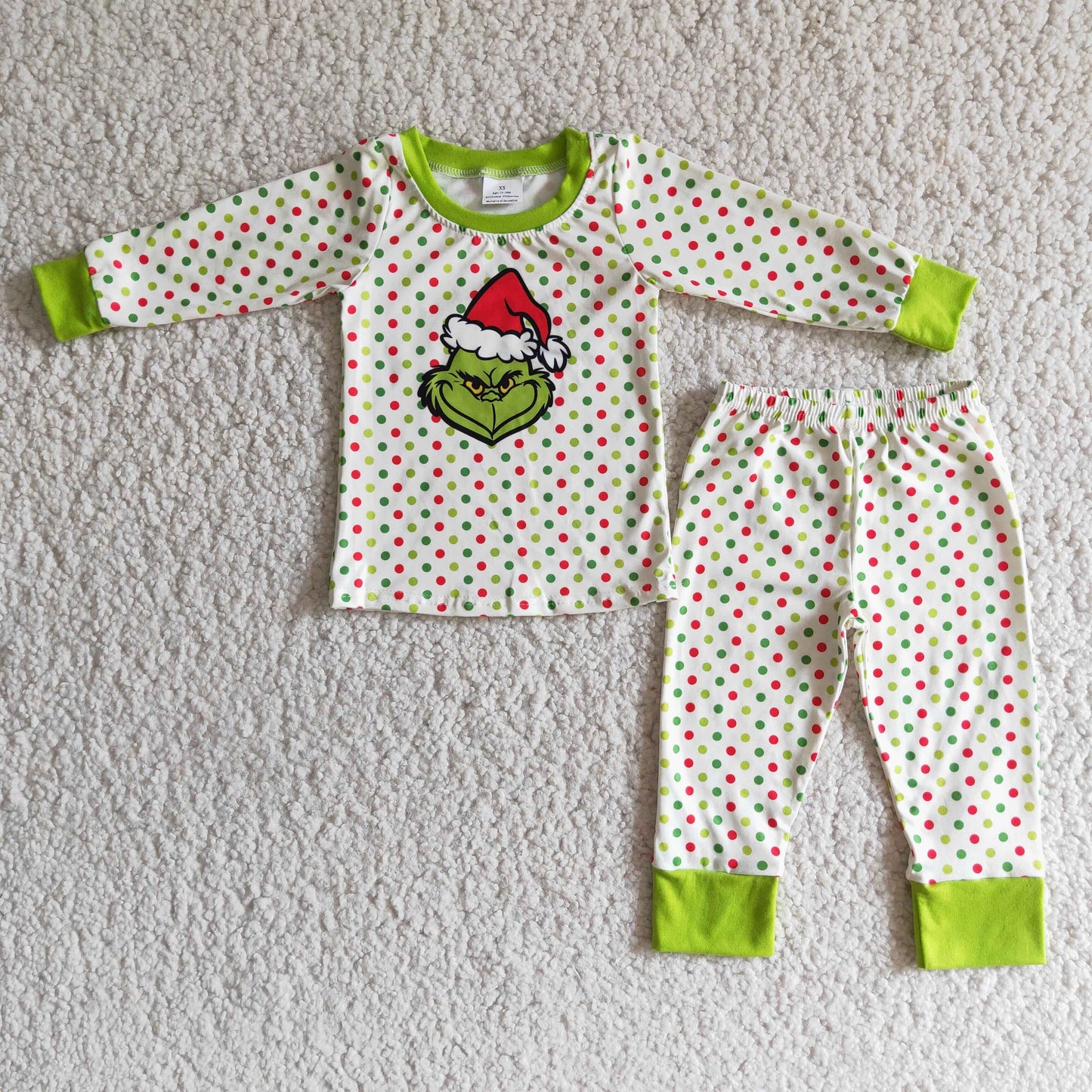 Grün gepunkteter Langarm-Jungen-Schlafanzug mit Gesichtsmotiv zu Weihnachten